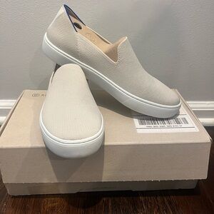 Cream Rothy’s Slip Ons